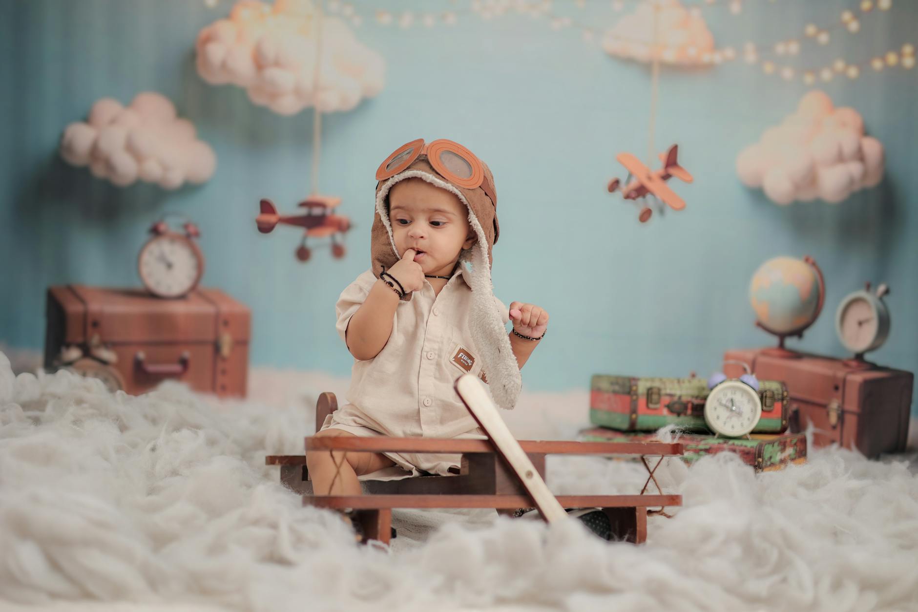 adorable baby pilot in vintage aviation setting